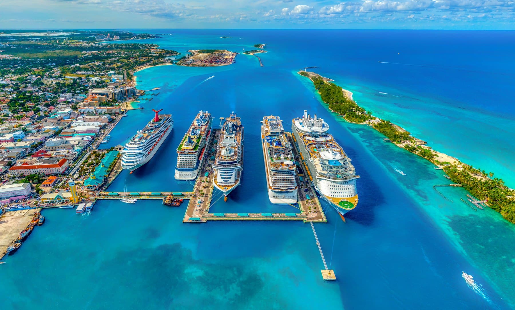 Cruise ship wake on open water under a wide sky.